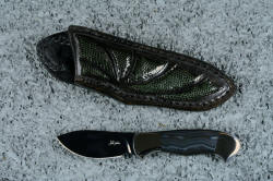 "Ullr", (without reflector above), obverse side view in deep cryogenically treated O1 tungsten-vanadium alloy tool steel blade, 304 stainless steel bolsters, Silver Crown Psilomelane gemstone handle, hand-carved leather sheath inlaid with gray lizard skin