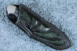 "Ullr", sheathed view in deep cryogenically treated O1 tungsten-vanadium alloy tool steel blade, 304 stainless steel bolsters, Silver Crown Psilomelane gemstone handle, hand-carved leather sheath inlaid with gray lizard skin