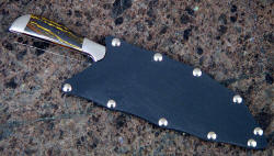 "Vega" Master Chef's Knife, sheathed view. Sheath is slip kydex with nickel plated steel hardware for corrosion resistant protection
