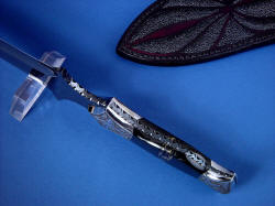 "Vesta" black rune dagger, athame, handle tang view showing deep full vine filework on blued tang, tang taper, matched placement of pyrite and shale mosaic gemstone in handle scales