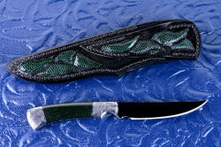 "Wasat" trailing point knife, reverse side view. Blued O1 blade is jet black, and sheath back has full inlays in lizard skin