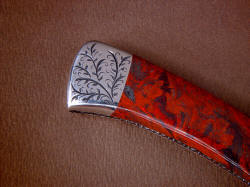 "Wasat" reverse side rear bolster engraving detail. Lines of stromatolite gemstone echoed in the curves of the light vine pattern of sthe engraving