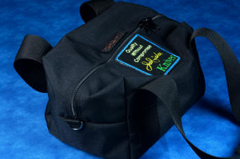 Duffle has heavy duty zippers, D-rings, emboidered patches, and heavy polypropylene webbing handles