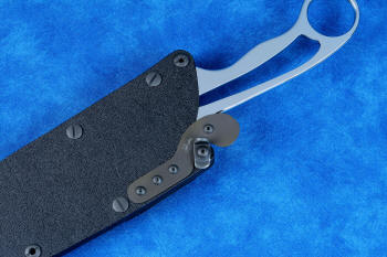 Locking tab wedge shown locking down the titanium dogleg spring, securing knife in the sheath