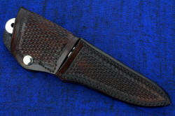 "Yarden" sheathed view. Sheath is fully protective with stainless steel flap protection and locking boss inside flat to lock handle into sheath