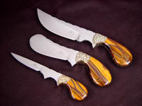 Trophy Game Set features a large field dressing knife, a deep belly skinner, and a fine tipped caping knife