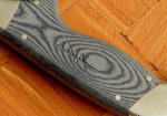 Black Canvas reinforced Micarta® phenolic, bead blasted. Engraved with sniper emblem