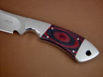 Red and black canvas Micarta. In this photo, the micarta is polished and smooth