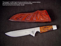 "Paraeagle" fine tactical knife in 440c high chromium stainless steel blade, custom etched, 304 stainless steel bolsters, Desert Ironwood handle, hand-carved and tooled leather sheath