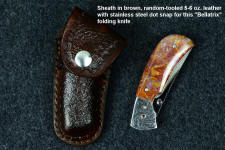 "Bellatrix" custom folding knife with random tooling pattern brown pocket sheath with brown heavy stitching and marine grade dot snaps