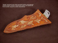 "Bootes" knife sheath has bronzed tooling,  hand carved on sheath face embellishment