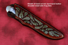 "Opere" sheathed view in 440C high chromium martensitic stainless steel blade, 304 stainless steel bolsters, Bay of Fundy Fossilized Agate gemstone handle, frog skin inlaid in hand-carved leather sheath