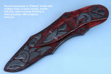 "Pallene" sheath back side view in CPM154CM high molybdenum powder metal technology tool steel blade, hand engraved, with hand-engraved 304 stainless steel bolsters, Brecciated Jasper gemstone handle, and a sheath of hand-carved leather inlaid with rayskin