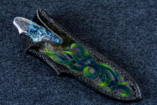 "Thuban" obverse side view in hot-blued 1095/nickel damascus blade, hand-engraved 304 stainless steel bolsters, Shattuckite gemstone handle, hand-carved, hand-dyed leather sheath