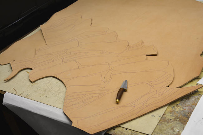 Cutting leather shoulder for sheath components