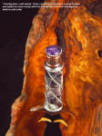 "Amethystine" The stand frames, surrounds, compliments the dagger and color of the amethyst gemstone, echoing the patterns in the burl and handle