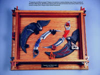 "Tunguska and Manicouagan" raptor kerambits in display case of mahogany, bloodwood, ebony