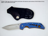 "Stratos" liner lock folding knife, obverse side view: 440C stainless steel blade, anodized 6AL4V titanium liners, leather, nickel plated steel sheath